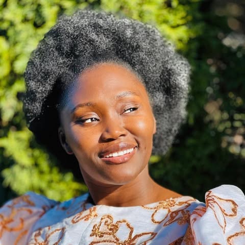 Sharon Mbungu Akinseye, smiling outdoors